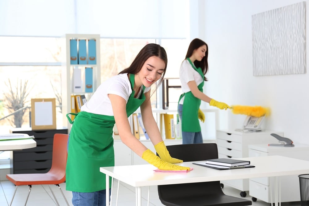 Cleaning service team working in office